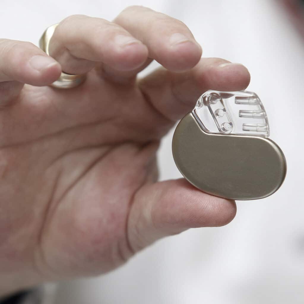 Hands of a medical researcher showing a device. Does your device needs eo residual testing?