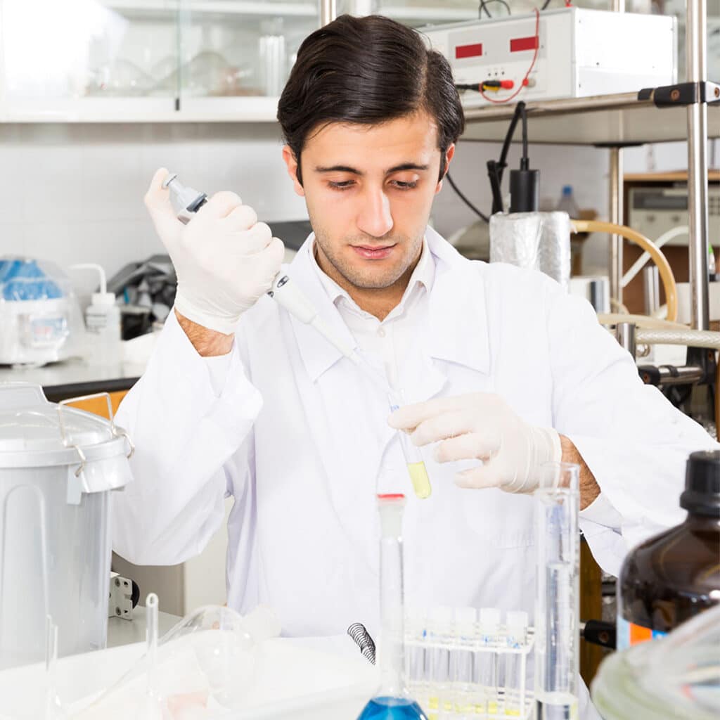 Bacterial Endotoxin Tests For Medical Devices. Scientist practicing microbiology tests for endotoxin limits in a laboratory