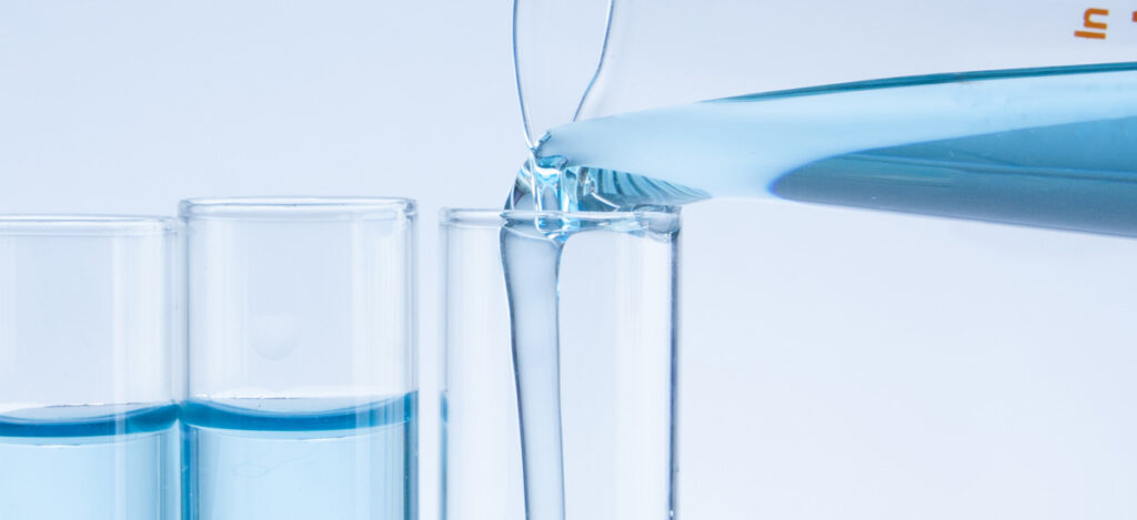 Close picture of a flask dropping liquid inside a test tube. Ethylene oxide depyrogenation. Ethylene oxide sterilization. What is depyrogenation by ethylene oxide. How common is ethylene oxide sterilization. What items can be sterilized by ethylene oxide. Differences between ethylene oxide sterilization and depyrogenation