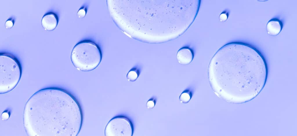 Illustration of drops of water on a violet surface. What is liquid phase sterilization. What do liquid sterilants include. Specific liquid sterilants. How is liquid phase sterilization performed. How do you select a liquid sterilant. How do you validate liquid sterilization process. Validate liquid sterilization processes