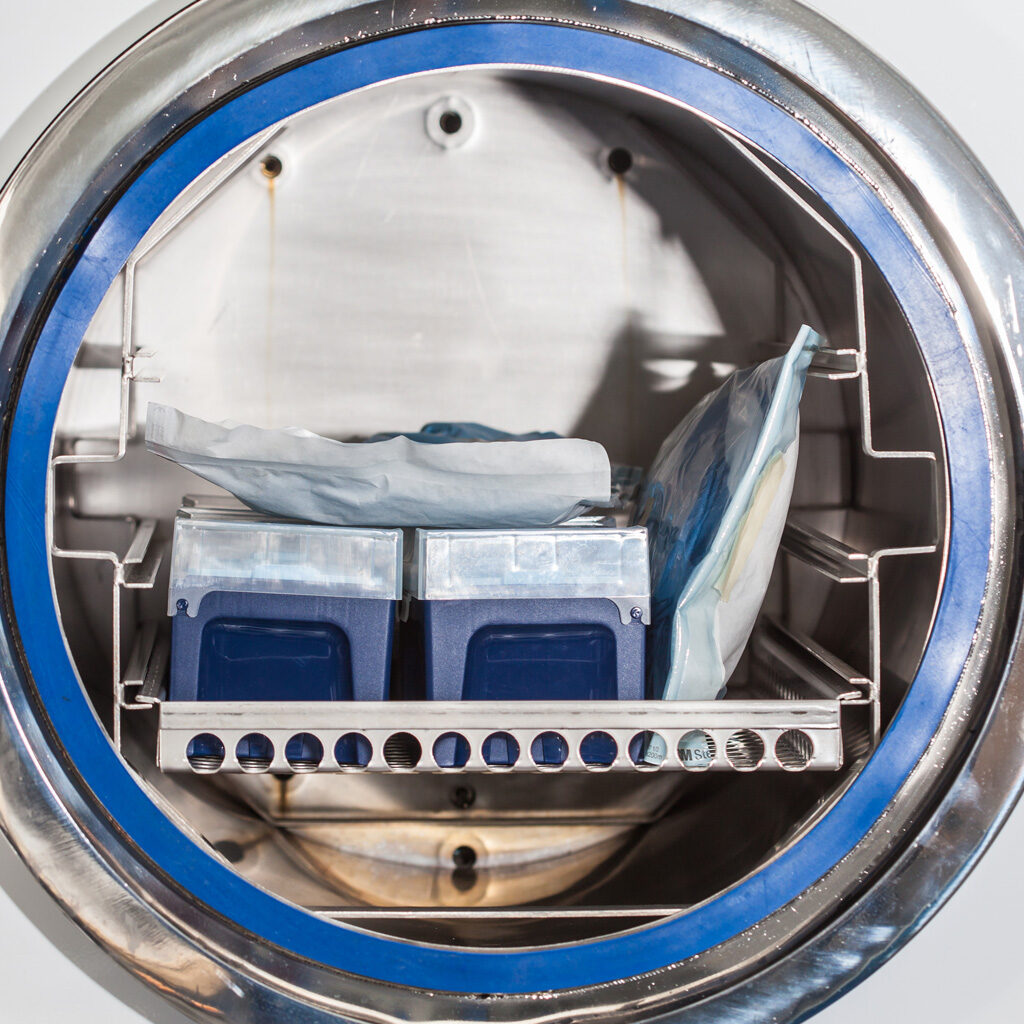 Close picture of an autoclave with medical devices inside of it. Which is the best sterilization method. Options for medical device sterilization. Sterilization method comparison chart. Sterilization method descriptions. Sterilization types